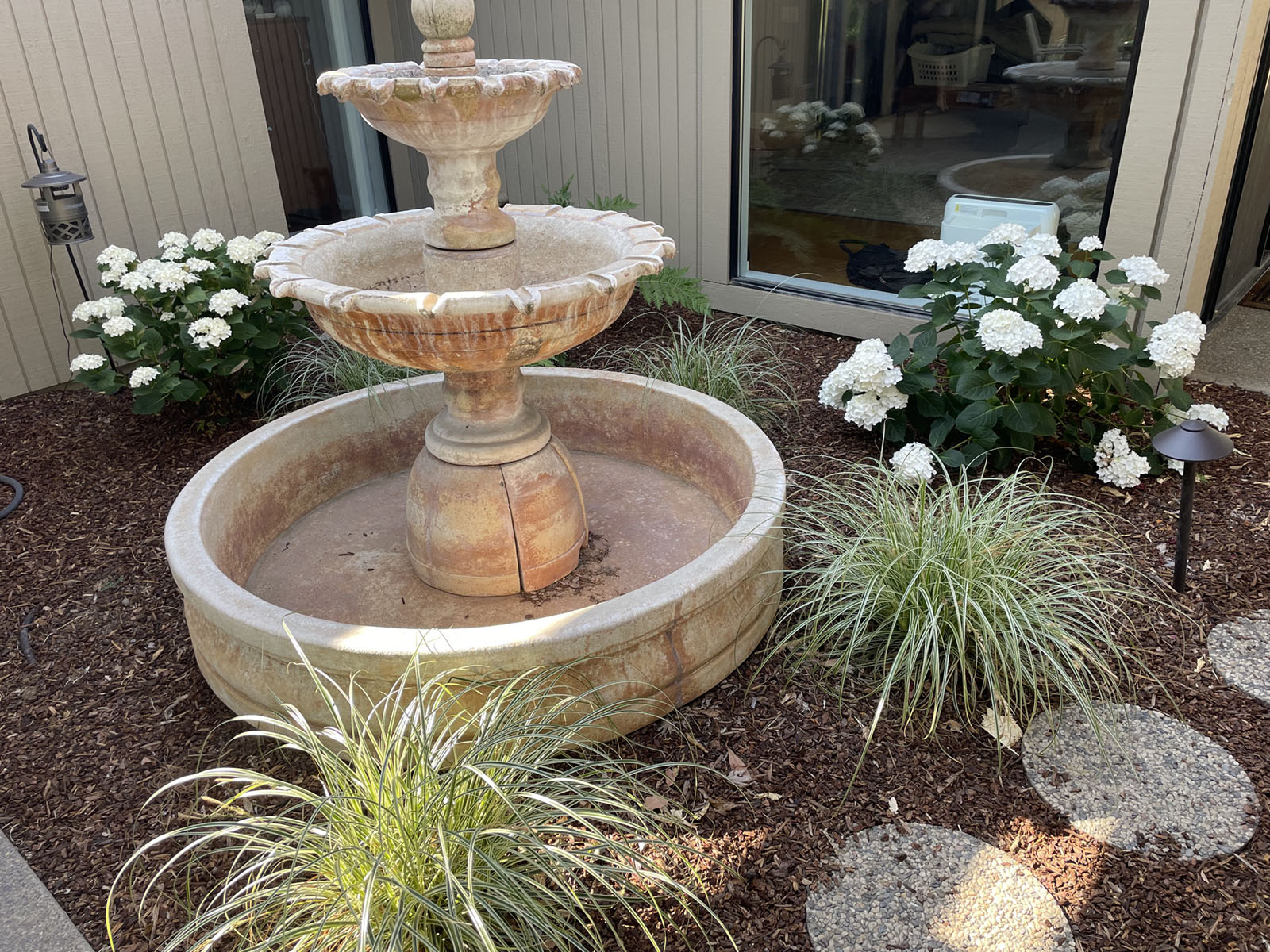 Water fountain, home and garden setting.